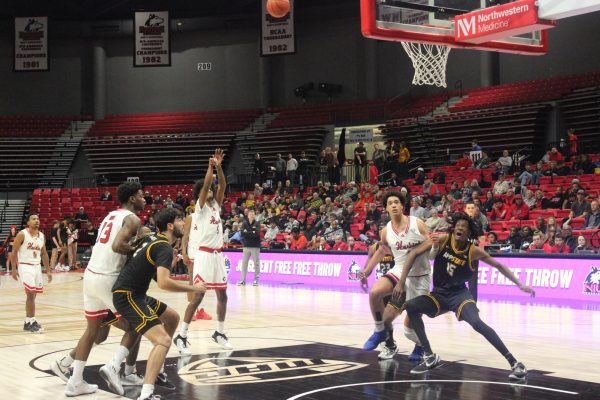 Senior guard Philmon Gebrewhit (5) shoots a free throw in NIU mens basketballs 2023-2024 home opener. The Huskies defeat Appalachian State University 91-78 on Saturday for their first win of the season. (Ryanne Sandifer | Northern Star)
