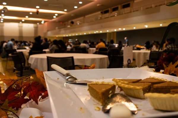 Slices of pumpkin pie sit ready to be plated by attendees of the International Thanksgiving Dinner event Monday. Instructors and their families were seated at tables, listening to the speakers within the Duke Ellington Ballroom within the Holmes Student Center. (Sean Reed | Northern Star)