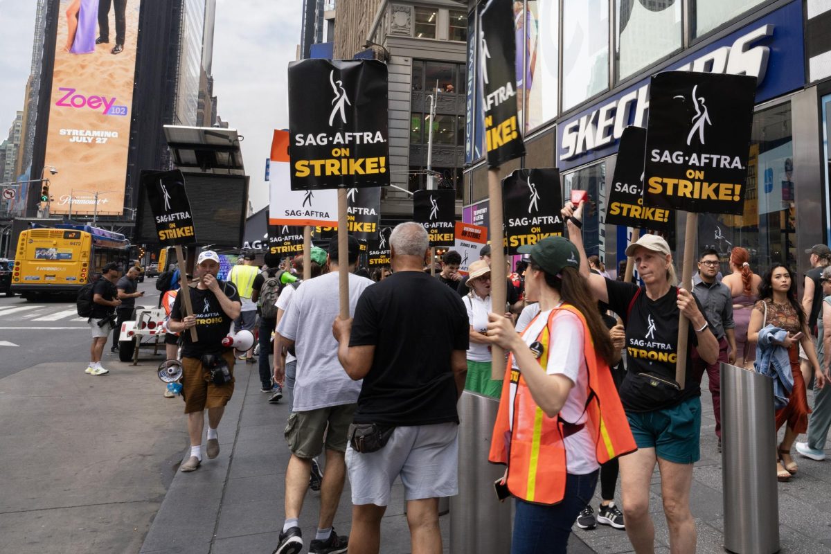 People march in New York City in support for the actors strike. Because of the strike, the release dates for several films have been pushed back. (Courtesy of Getty Images)