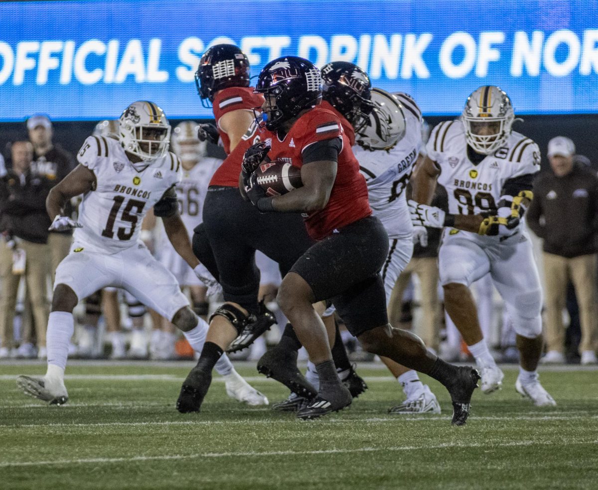 Junior running back Antario Brown rushes the ball during NIU footballs 24-0 win over Western Michigan on Nov. 14. The Huskies enter the final game of the season needing a win to be bowl eligible. (Tim Dodge | Northern Star)
