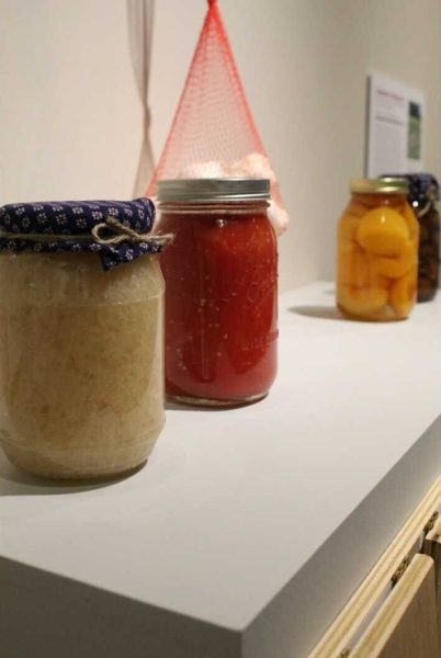 A display shows four jars of food sitting next to each other. This is a small section of the “Good Food” exhibit that shows the perseveration process of food and instructions on how to preserve your own food. (Sasha Norman | Northern Star)
