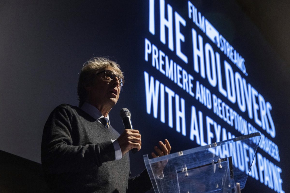 Director Alexander Payne speaks to an audience at the premiere of The Holdovers. The films plot may seem fast-paced at some moments, but the emotional elements drive the story forward. (Chris Machian/Omaha World-Herald via AP)
