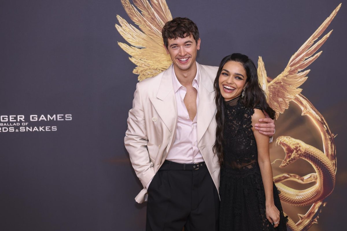 Tom Blyth (left) and Rachel Zegler pose in London for the world premiere of The Hunger Games: The Ballad of Songbirds & Snakes. The film releases in theaters on Nov. 17. (Vianney Le Caer/Invision/AP)