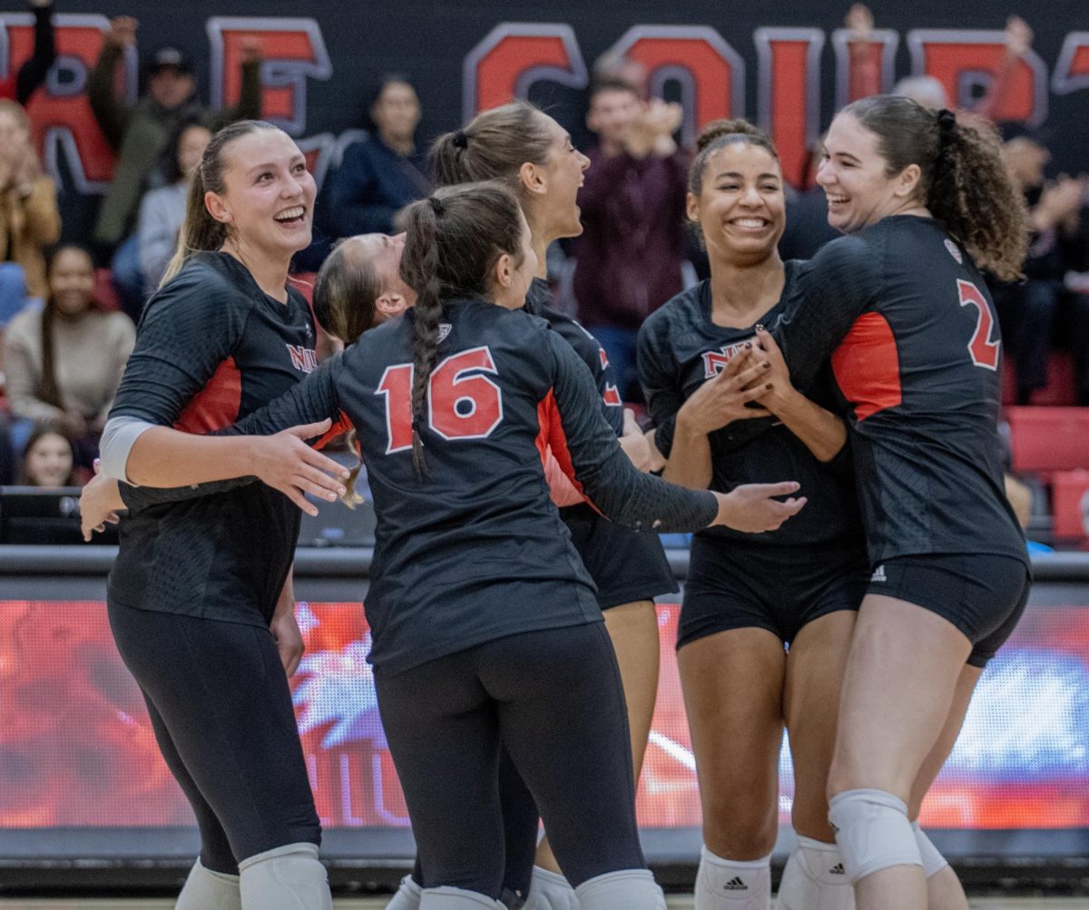 NIU+volleyball+players+celebrate+after+NIU+junior+middle+blocker+Charli+Atiemo+blocks+the+ball+against+the+University+of+Akron+on+Oct.+27.+The+Huskies+were+swept+by+the+Toledo+Rockets+on+Saturday.+%28Tim+Dodge+%7C+Northern+Star%29