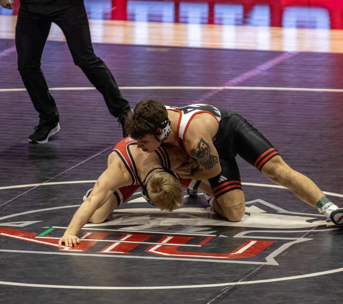 Redshirt freshman Danny Curran (right) grapples with redshirt freshman Dylan Gvillo (left) during the Huskie Duals exhibition last Friday. The Huskies first dual takes place Friday against Lindenwood and St. Ambrose. (Tim Dodge | Northern Star)