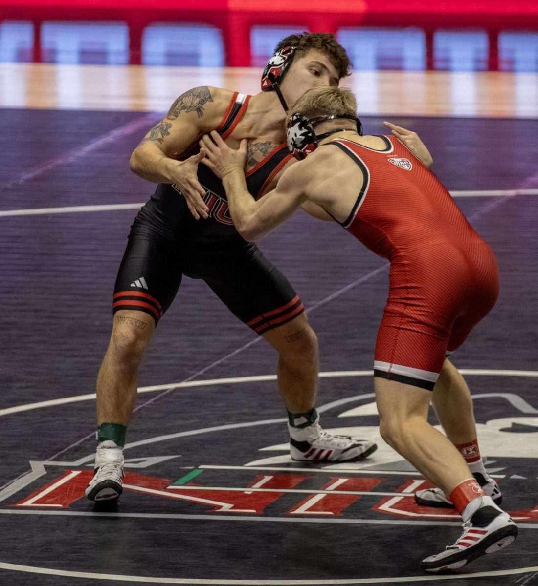 Redshirt freshman Danny Curran grapples with redshirt freshman Dylan Gvillo during the red/black dual on Oct. 27. The Huskies took 11th place at the MSU Open on Saturday (Tim Dodge | Northern Star)