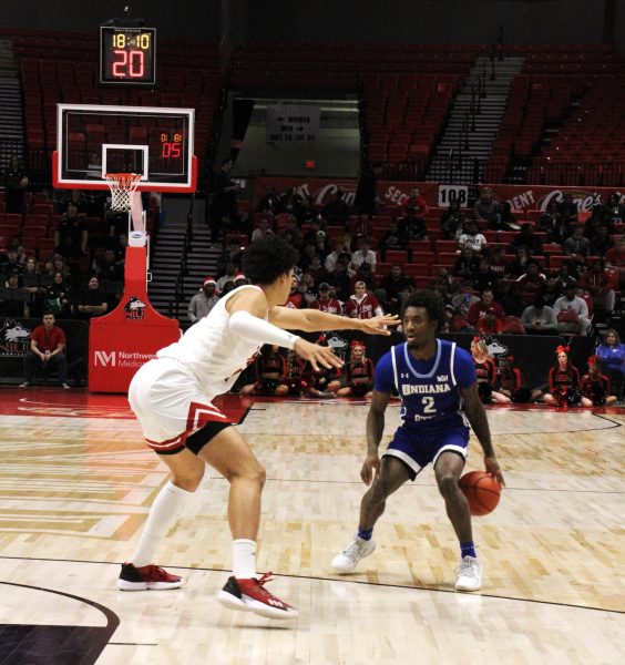 Sophomore forward Yanic Konan Niederhauser (14) guards Indiana State junior guard Isaiah Swope (2) as he attempts to pass the ball during the game Tuesday.