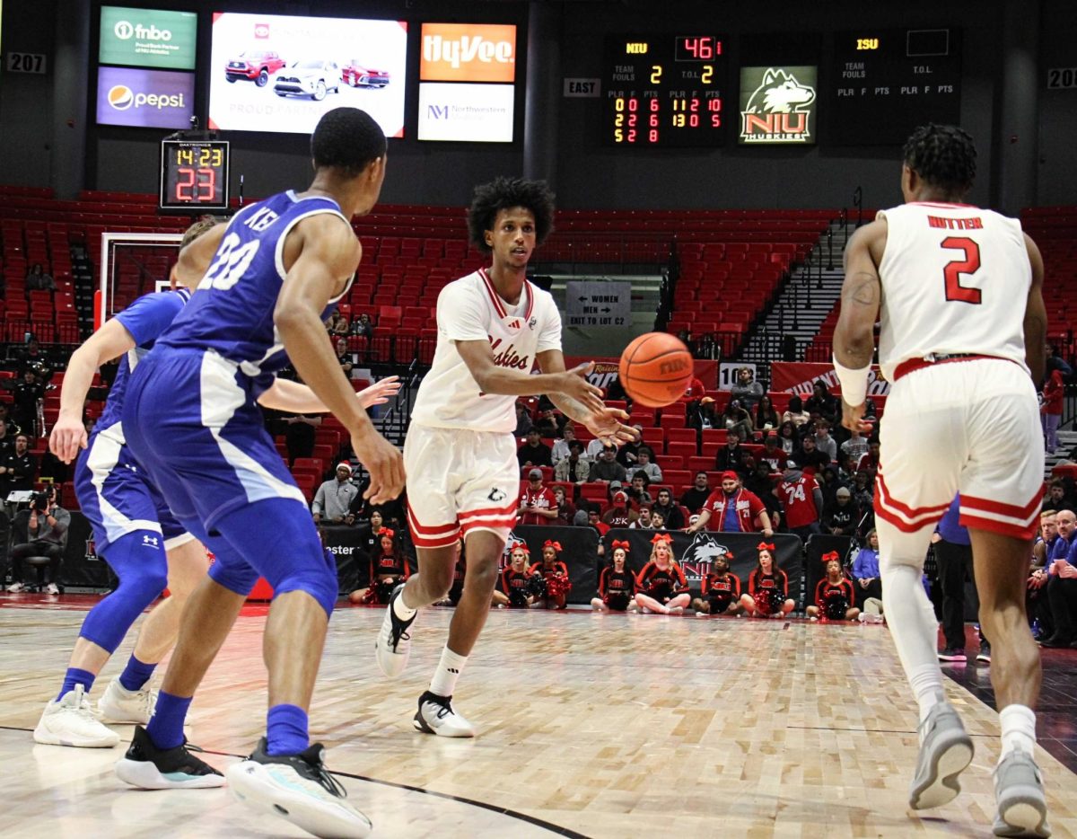 Senior guard Philmon Gebrewhit hands the ball off to junior guard Zarique Nutter during an NIU mens basketball home game against Indiana State University on Tuesday. Gebrewhit is averaging 10.9 points per game in his first season in a Huskie uniform. (Nyla Owens | Northern Star)