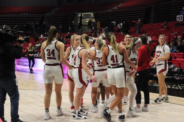 NIU womens basketball teams huddled together to celebrate after Tuesdays match against Lindenwood University. Though viewership has steadily increased, womens sports deserve more coverage. (Ryanne Sandifer | Northern Star)