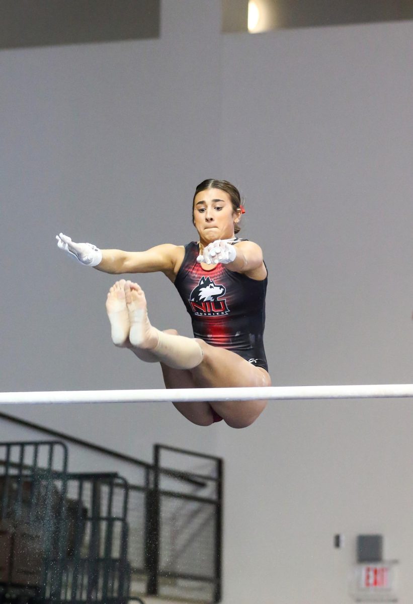 Junior Isabella Sissi performs her routine on the uneven parallel bars during Saturdays meet against Bowling Green State University at the Stroh Center in Bowling Green, Ohio. NIU gymnastics is set to compete at the Tennessee Collegiate Classic on Friday. (Courtesy of Dena Martz) 