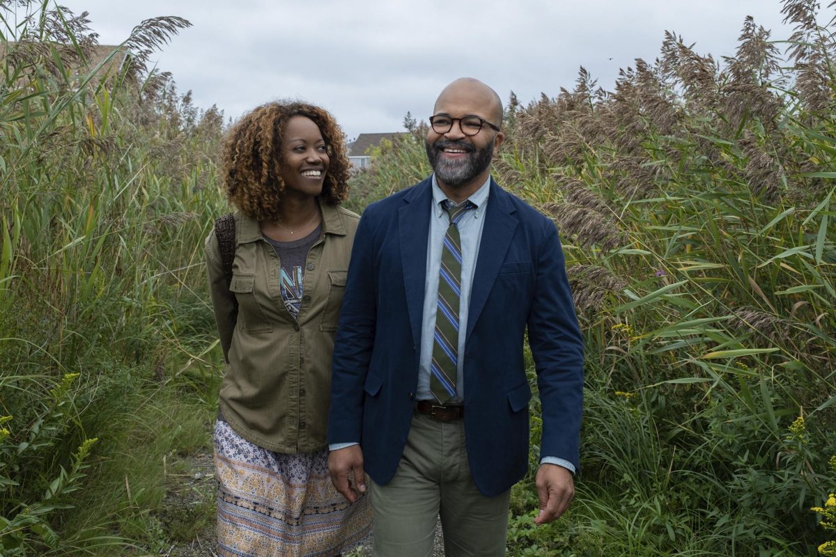 Erika Alexander (left) and Jeffery Wright walk through some plants in a scene from American Fiction. Wright was the lead actor in the December release. (Claire Folger/MGM-Orion via AP)