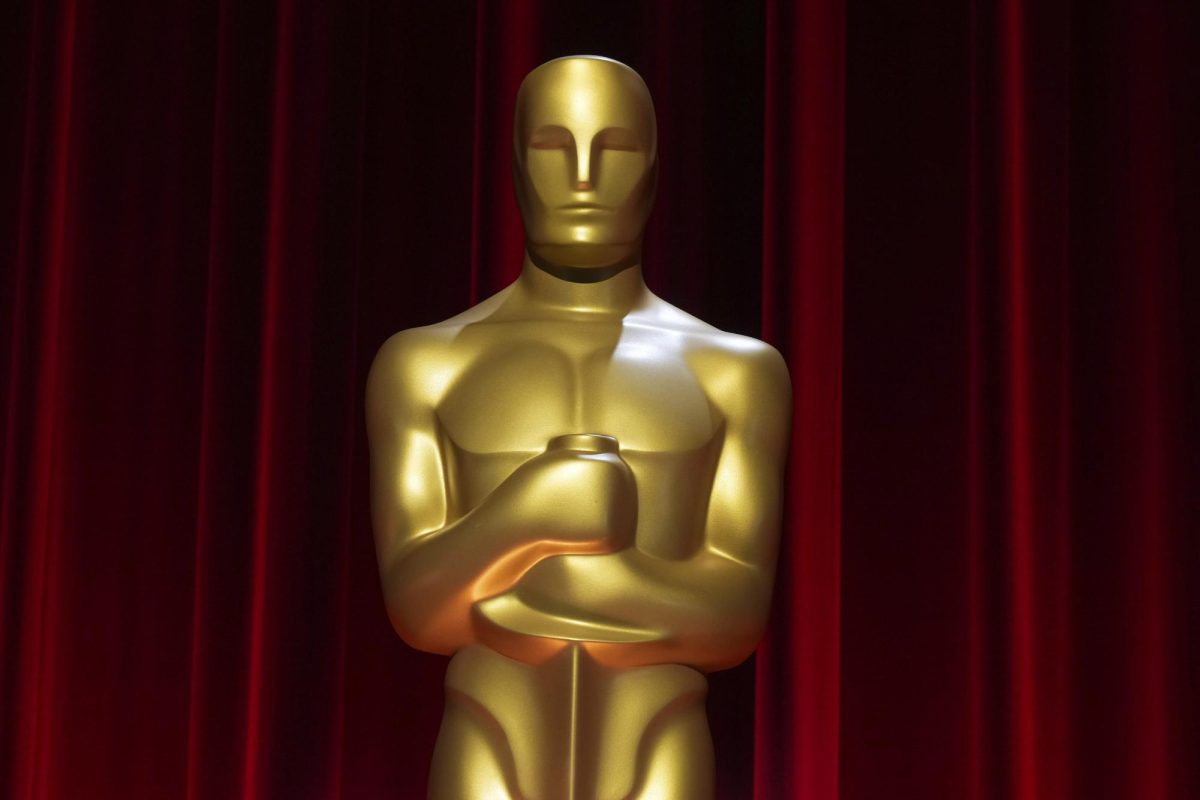 The Oscars trophy stands in front of red curtains. This years Oscar Nominations were announced Tuesday. (Photo by Jordan Strauss/Invision/AP)
