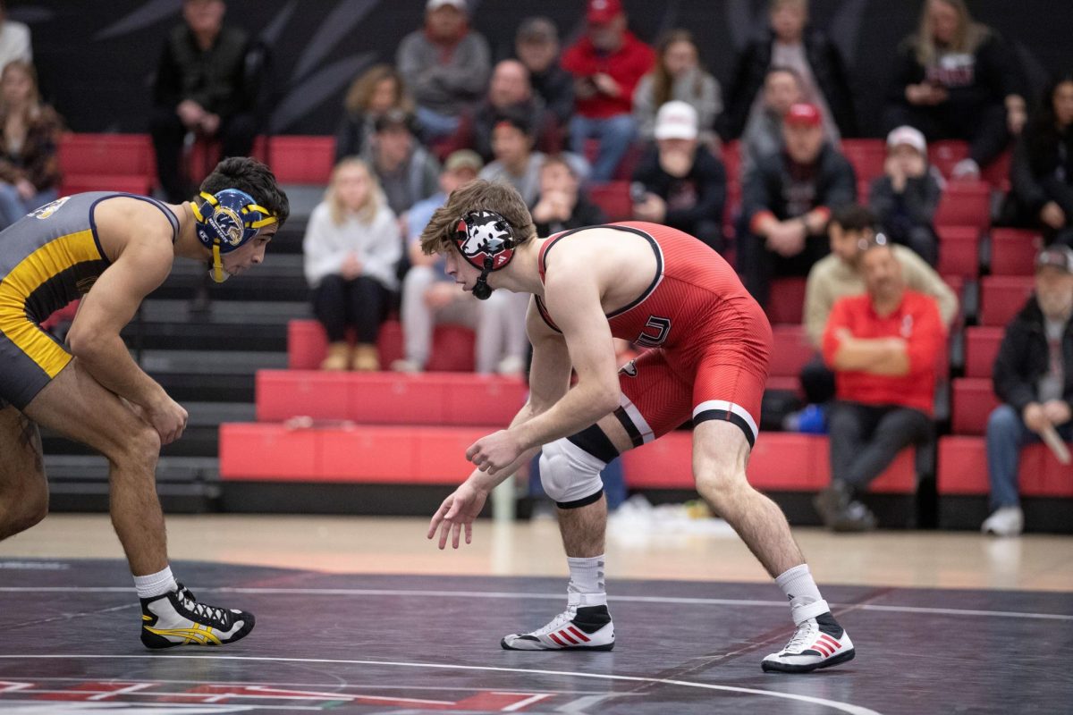 Redshirt sophomore Blake West searches for an opening on his Kent State University opponent. West was named the MAC Scholar-Athlete of the Week on Monday following his major decision victory over Ohio University freshman Ryan Meek on Friday. (Scott Walstrom | NIU Athletics)