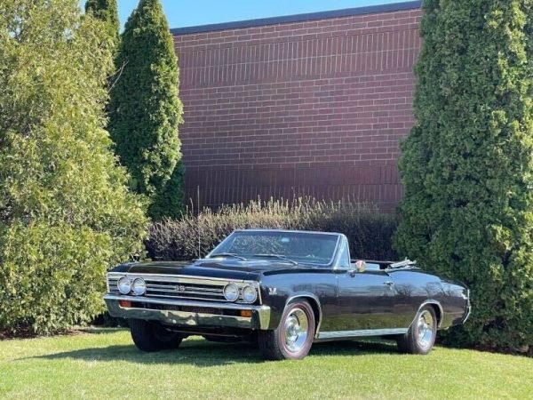 A 1967 Chevrolet Chevelle sits parked in front of a brick wall. The car is for sale by Classic Auto Haus, a car dealership set to open in February in DeKalb.  (Courtesy of Classic Auto Haus)