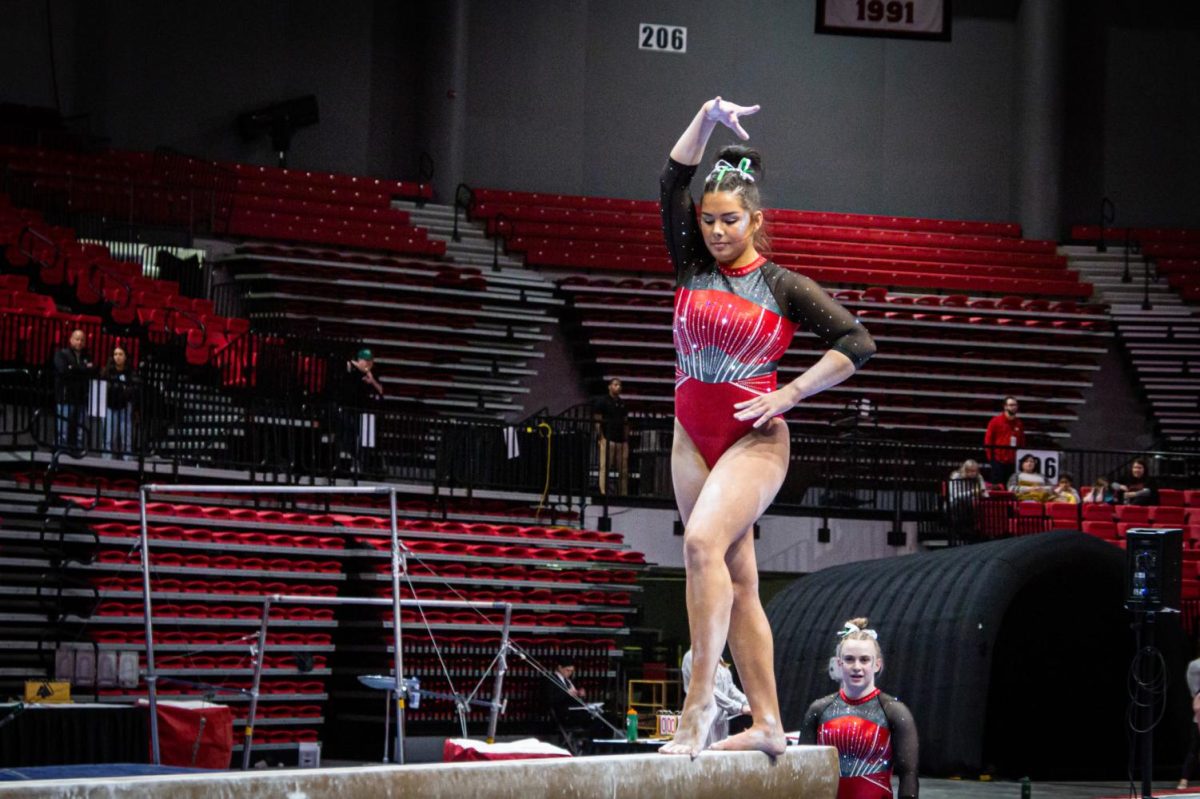 Then-junior gymnast Alyssa Al-Ashari started her beam routine at the EMU gymnastics meet on Feb. 17. The Huskies kick off the 2024 season at the Missouri Quad Meet Saturday. (Northern Star File Photo)