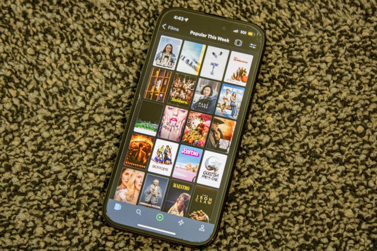 A phone sits on carpet with the screen open to the Letterboxd app. The app helps connect film watchers with films they want to watch and other people who love the medium of film. (Sean Reed | Northern Star)
