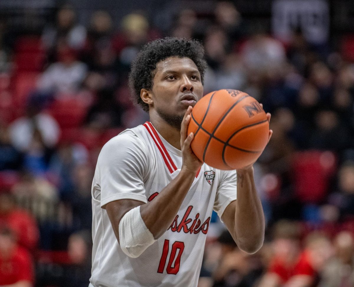 Redshirt sophomore guard Zion Russell (10) attempts a free throw late in the second half of an NIU mens basketball home game. Russell announced Sunday that he will be transferring to Niagara University. (Tim Dodge | Northern Star)