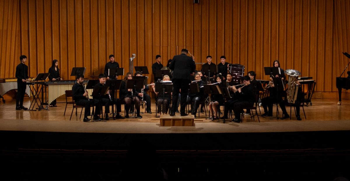 UIC College Prep Wind Ensemble, directed by Justin Boyd, performs second to last after Normal’s Wind Symphony. UIC College Prep’s four music selections were “Fanfare and Fireworks” by Brain Balmages, “Andalucía” by Victor López, “Chorale Elaga’nt” by Elena Lucas and “Escape from Thunder Mountain” by Scott Watson. (Totus Tuus Keely | Northern Star)