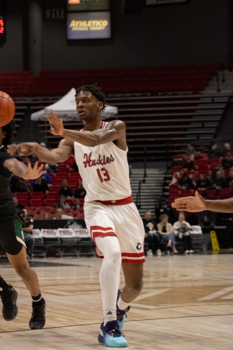 Sophomore forward Xavier Amos passes the ball during an NIU mens basketball home game against Eastern Michigan University on Feb. 3. Amos led the Huskies in scoring with 19 points Saturday against the University of South Alabama. (Sean Reed | Northern Star)