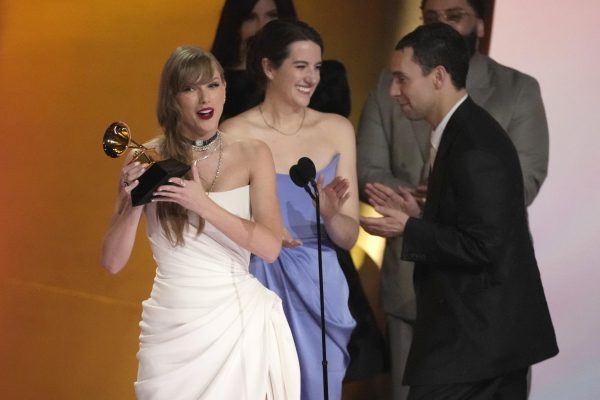 Taylor Swift accepts the Grammy award for Album of the Year on Feb. 4. Swifts album announcement during the ceremony was a selfish choice and took the attention away from other artists. (AP Photo | Chris Pizzello)