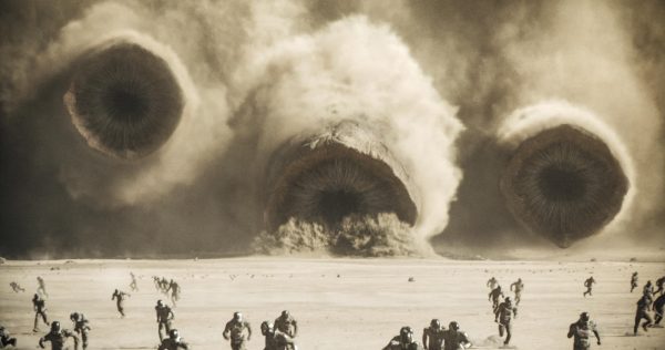 In a scene from Dune: Part Two, three sandworms move toward a group of people. Dune: Part Two released Friday and is the follow-up of 2021s Dune. (Warner Bros. Pictures via AP)