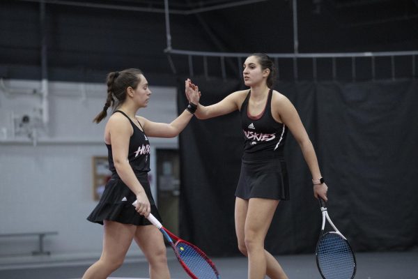 Sophomore Nataly Ninova (left) and junior Erika Dimitriev celebrate a point during an NIU womens tennis home match against the University of Wisconsin on Saturday. The pair won their doubles match against the University of Iowa and each won their singles match against the University of Northern Iowa on Friday. (Courtesy of NIU Athletics)