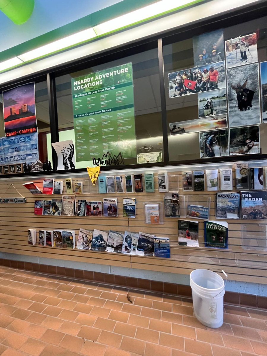 Brochures and pamphlets hang on a wall inside NIUs Outdoor Adventures office. Outdoor Adventures offers a variety of activities and resources that can meet any free-spirited student. (Sofia Didenko)