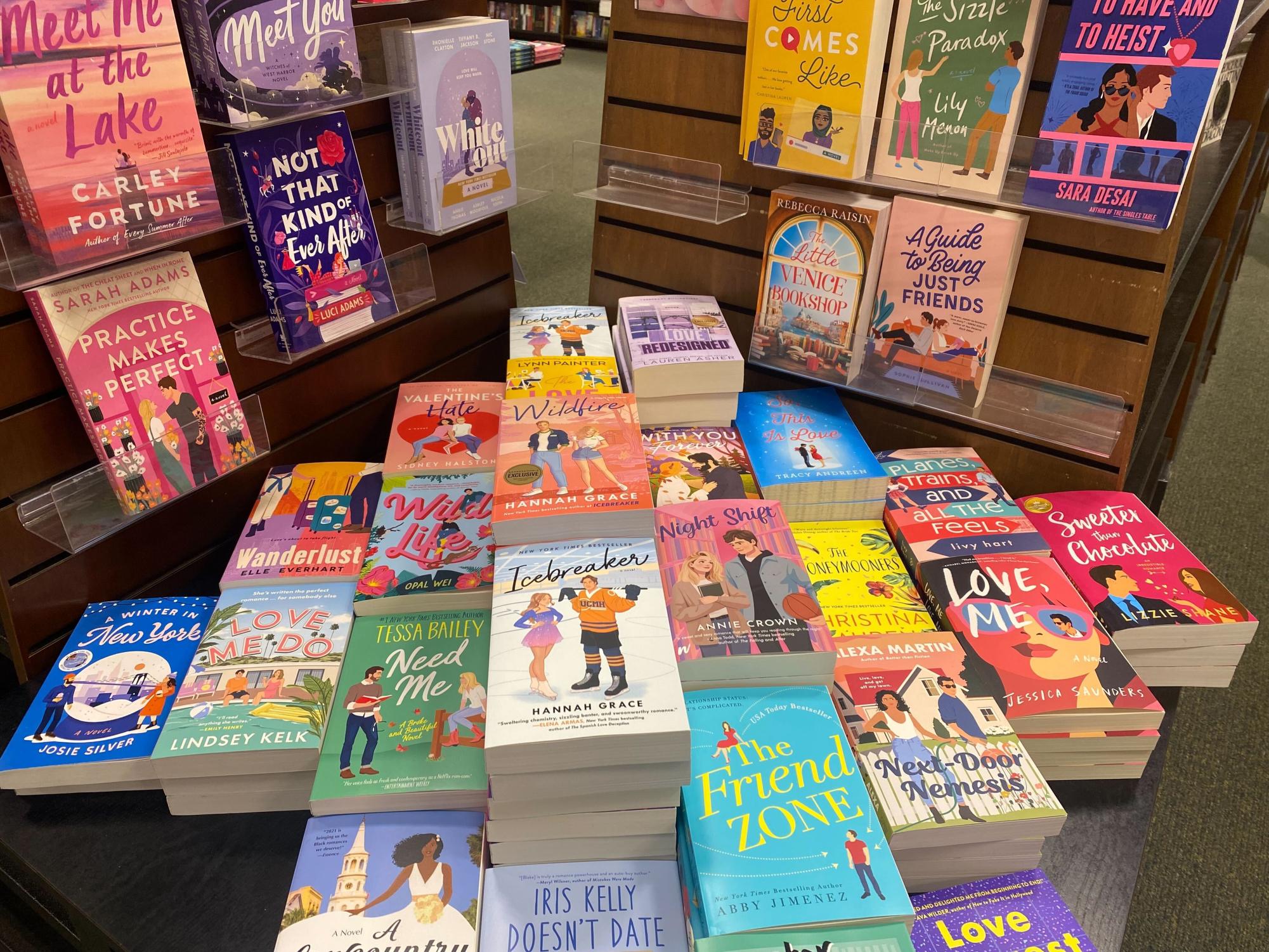 Stacks of romance books with cartoon covers are displayed at the Peoria Barnes and Nobel location. Books with smut should not be marketed toward minors. (Angelina Padilla-Tompkins | Northern Star)