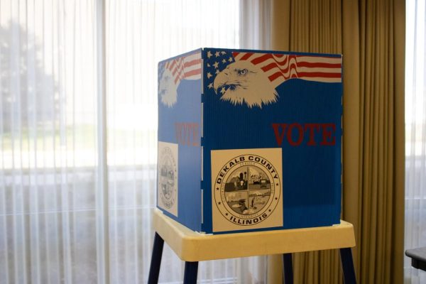 A voting booth stands in front of a window Nov. 8, 2022 within the Barsema Alumni and Visitors Center. Illinois primary election will take place March 19. (Northern Star File Photo)
