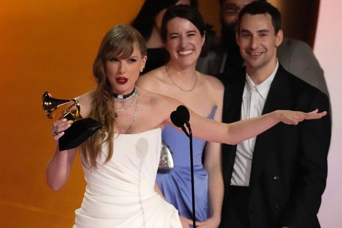 Taylor Swift holds a Grammy award as she accepts the award for “Album of the Year.” The 66th Grammy awards took place in Los Angeles on Sunday. (AP Photo/Chris Pizzello) 
