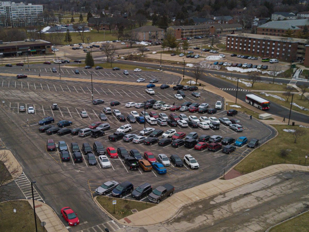 Lot C sits half full during morning classes on Friday. During peak times, Lot C parking spots are often scarce as commuters and professors share paid spaces at the center of campus, close to many of the liberal arts buildings. (Totus Tuus Keely | Northern Star)