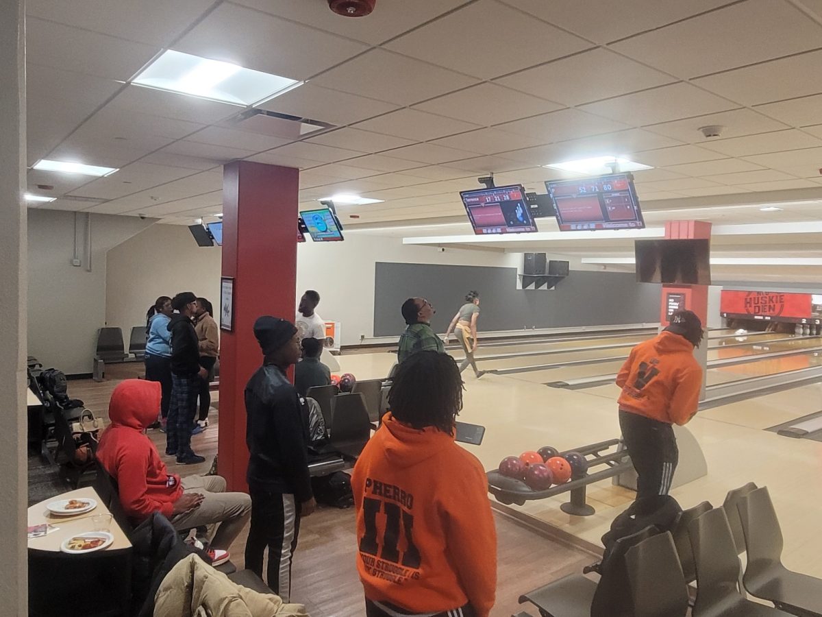 Students line up waiting for their turn to bowl. On Wednesday, the Center for Black Studies hosted a Bowling Night for people to celebrate Black History Month and hang out. (Kayla Martin | Northern Star) 