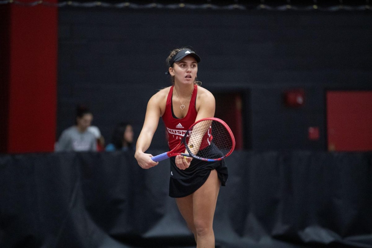 Sophomore Isabella Righi sets up her serve in an NIU womens tennis home meet. Righi won her match against Chicago State sophomore Amina Taibi 6-2, 6-4 as womens tennis defeated the Cougars 4-3 Sunday. (Courtesy of NIU Athletics)