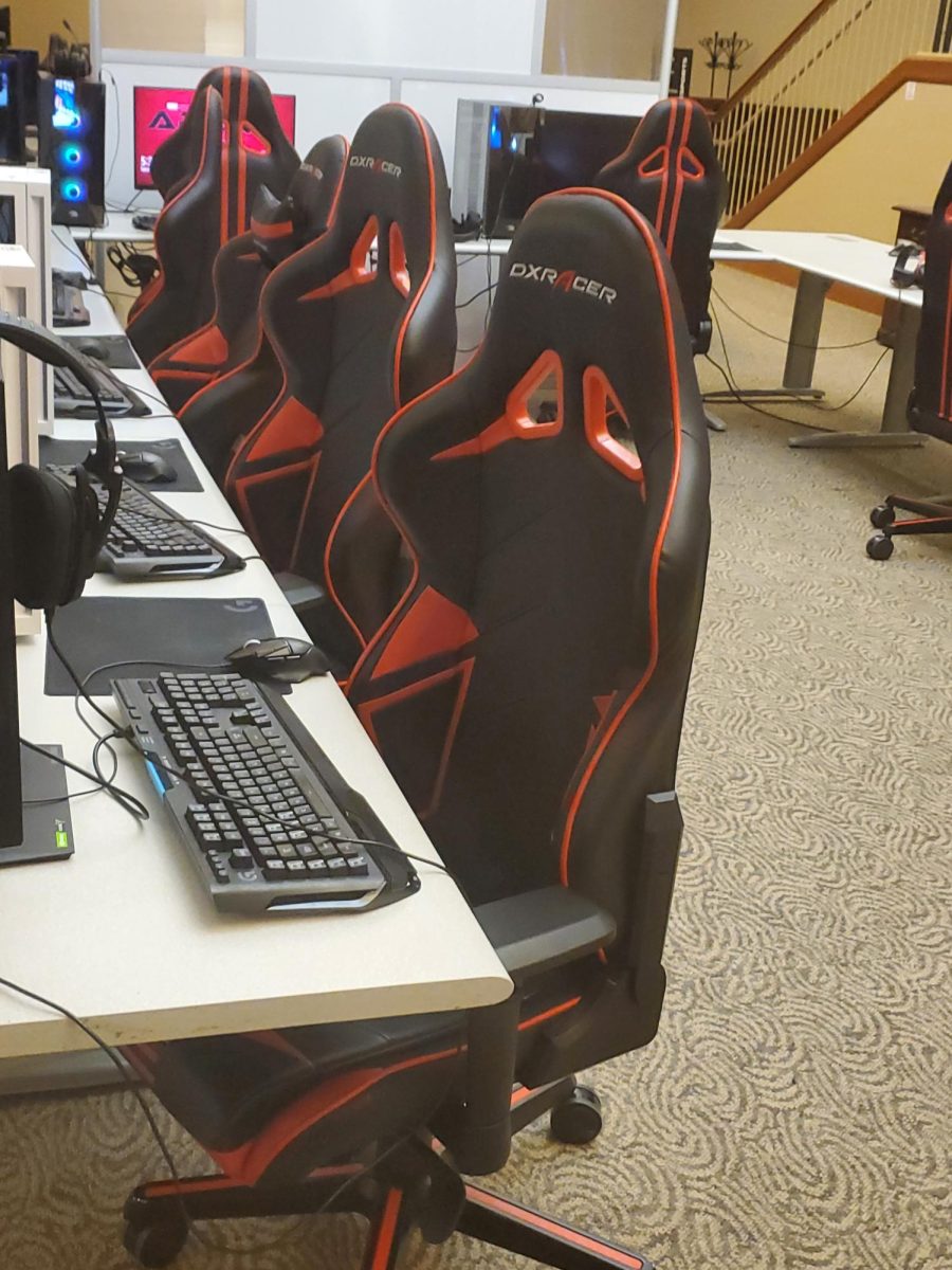 Empty red and black gaming chairs sit in the ESports arena. The arena held a Rocket League championship event Saturday. (Jonathan Shelby | Northern Star)