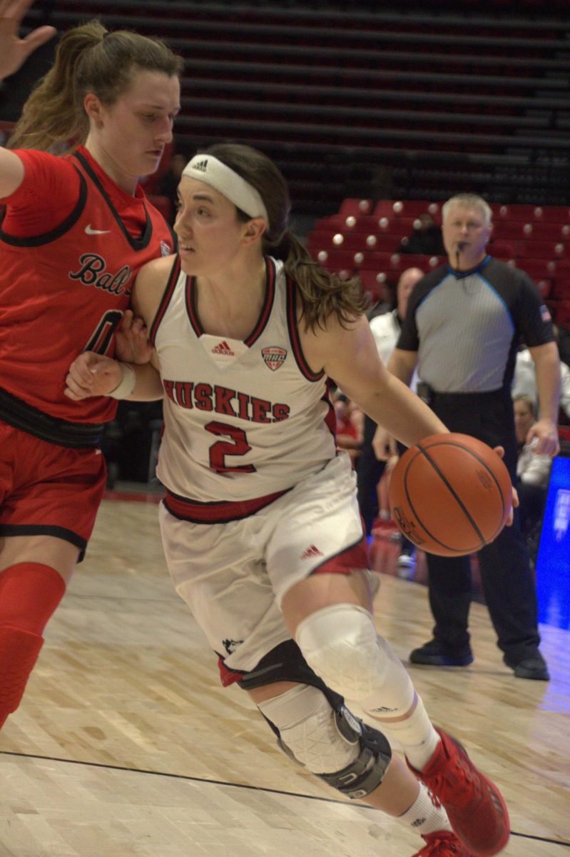 Redshirt junior guard Sidney McCrea drives past a Ball State University defender in an NIU womens basketball home game Wednesday. McCrea led the Huskies in scoring with 17 points in a 76-71 victory over the Cardinals. (Katherine Follmer | Northern Star)