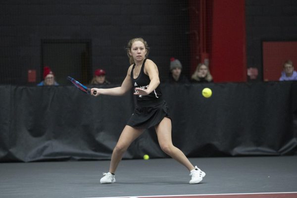 Sophomore Jenna Horne prepares for a shot against the University of Wisconsin-Madison on Jan. 20. Horne won her doubles match with junior Reagan Welch 6-3 against Marquette University. (Courtesy of NIU Athletics)