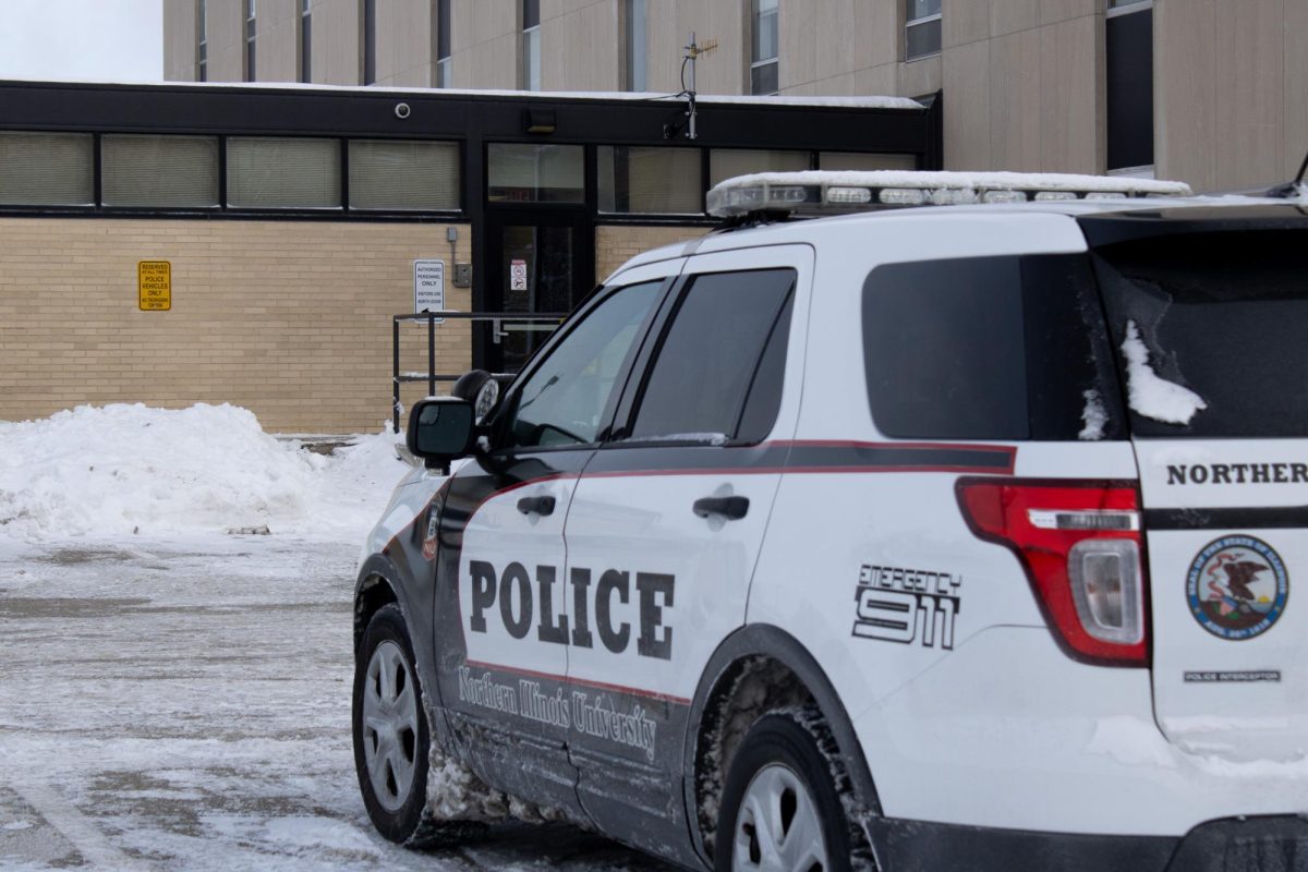 An NIU Police car sits empty in front of the on-campus department. Crimes including mob action and aggravated battery were reported in Jan. 2024 on NIUs campus. (Sean Reed | Northern Star)