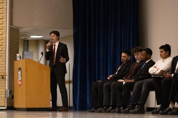 Aidan O’Brien, a junior marketing major and student trustee candidate, stands and addresses the crowd. The Student Government Association held a debate on Thursday for students to get to know the candidates. (Sean Reed | Northern Star)