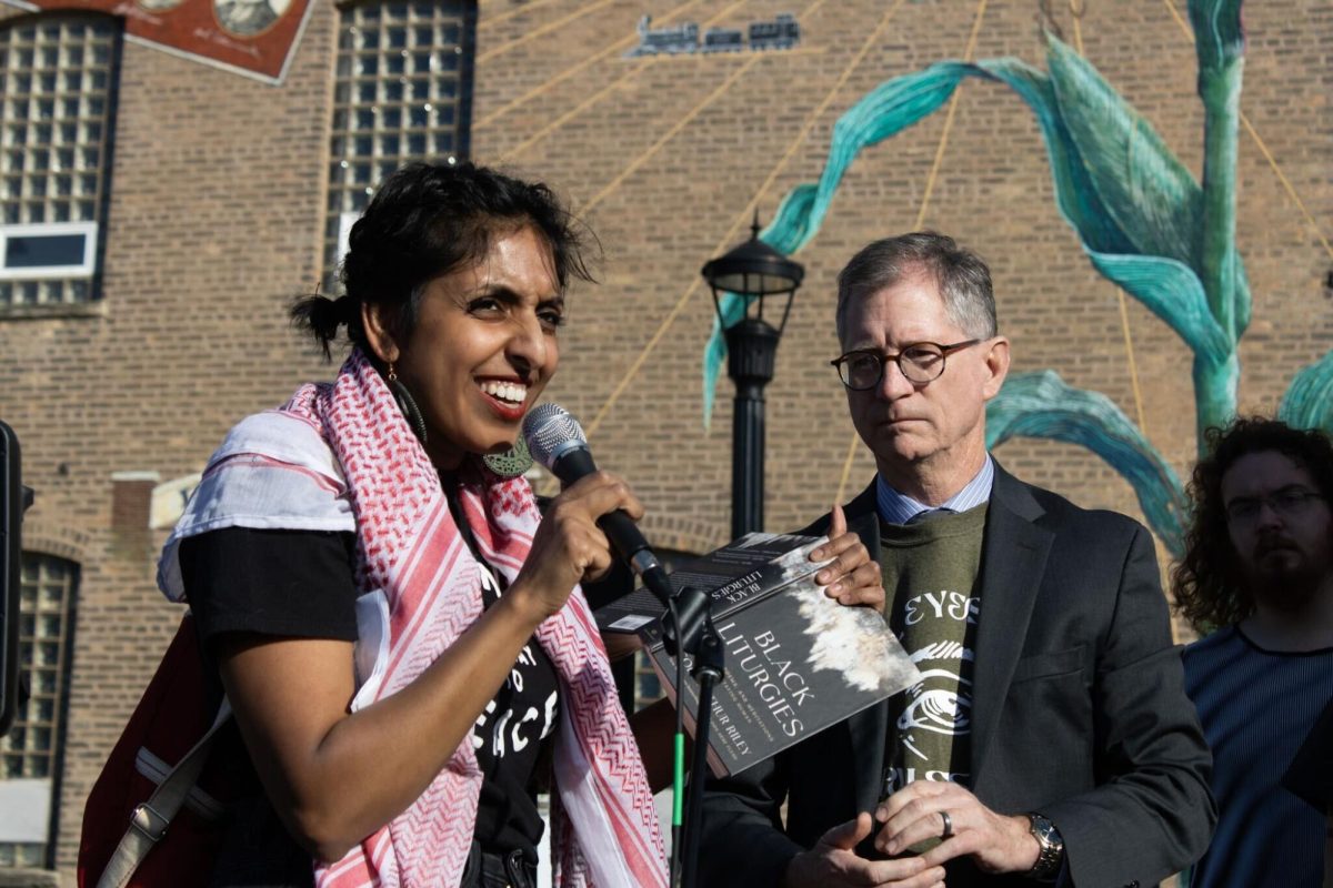 Shrestha Singh (left), a DeKab resident, addresses the crowd with Rev. John C. Dorhauer of the United Church of Christ. DeKalb had a protest against the United States’ funding of Israel with approximately 80 supporters. (Sean Reed | Northern Star)