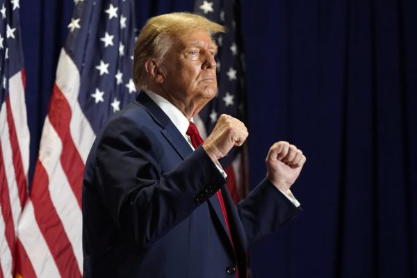 Donald Trump raises two fists at a campaign rally Saturday in Richmond, Virginia. Opinion Columnist Will Thiel is voting for Trump in the 2024 presidential election. (AP Photo | Steve Helber)