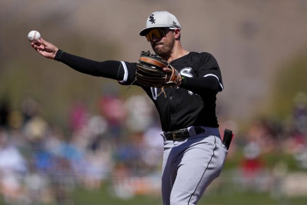 Chicago White Sox shortstop Danny Mendick throws a baseball during the second inning of a spring training baseball game Friday in Tempe, Arizona. The White Sox and Chicago Cubs are set for their respective Opening Day games on Thursday. (AP Photo/Matt York)