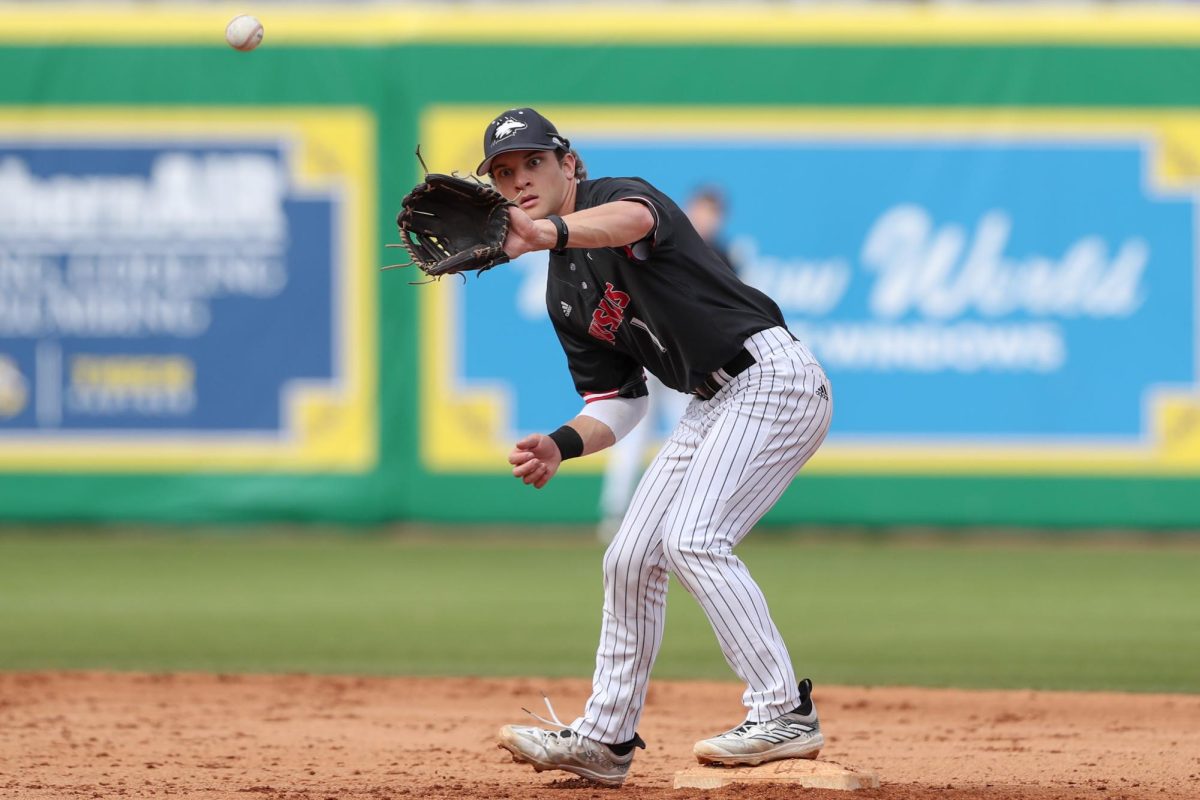 Senior infielder Andre Demetral focuses on a throw during an NIU baseball game against Louisiana State University. Demetral recorded one hit in the Huskies 14-1 loss to the University of Cincinnati on Sunday. (Courtesy of Jonathan Mailhes)