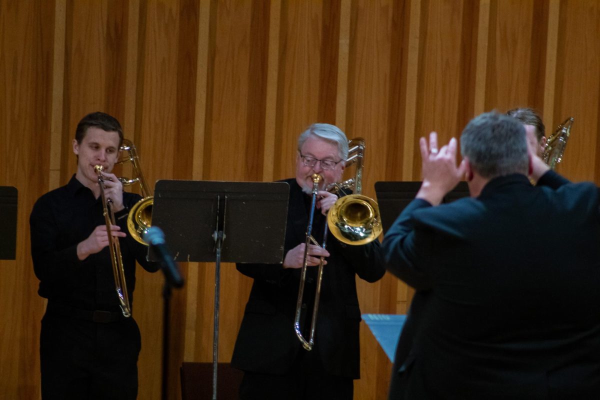 Instructor+of+Trombone+Timothy+Riordan+conducts+the+NIU+Trombone+Choir%E2%80%99s+second+piece%2C+%E2%80%9CTenebrae+Factae+Sunt%2C%E2%80%9D+composed+by+Marc%E2%80%99+Antonio+Ingegneri%2C+who+lived+from+1535+to+1592.+%E2%80%9CTenebrae+Factae+Sunt%E2%80%9D+translates+to+%E2%80%9Cdarkness+has+been+made%E2%80%9D+and+is+about+the+gospels+of+the+crucifixion.+%28Totus+Tuus+Keely+%7C+Northern+Star%29