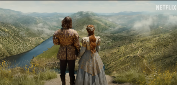 A boy and a girl stand next to each other overlooking a valley. Millie Bobby Brown stars as a warrior-princess in her new Netflix film Damsel. (Netflix under Fair Use)