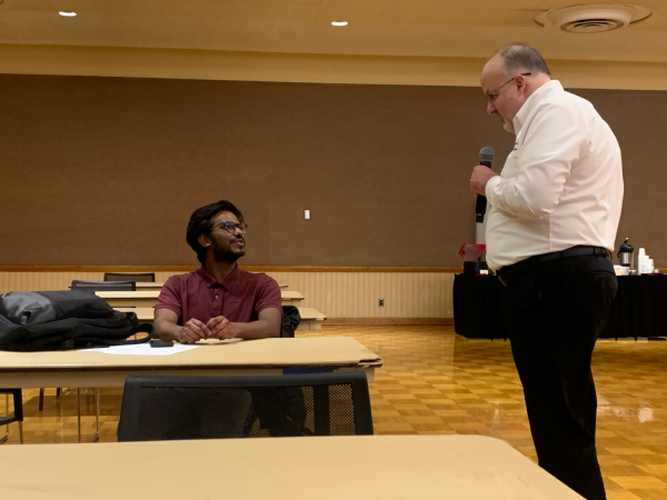 Brian Pillsbury, director of Career Services talks to Vishnu Gopu, a graduate student. Career Services will host career panels throughout the week. (Victoria Wakeford | Northern Star)