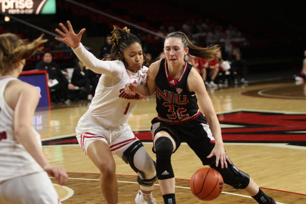 Junior guard Laura Nickel (32) pushes through Miami University graduate student guard Jordan Tuff (1) while driving towards the paint. Nickel scored 11 points and grabbed 7 rebounds off the bench in a 56-46 win over the RedHawks. (Courtesy of Miami Athletics)