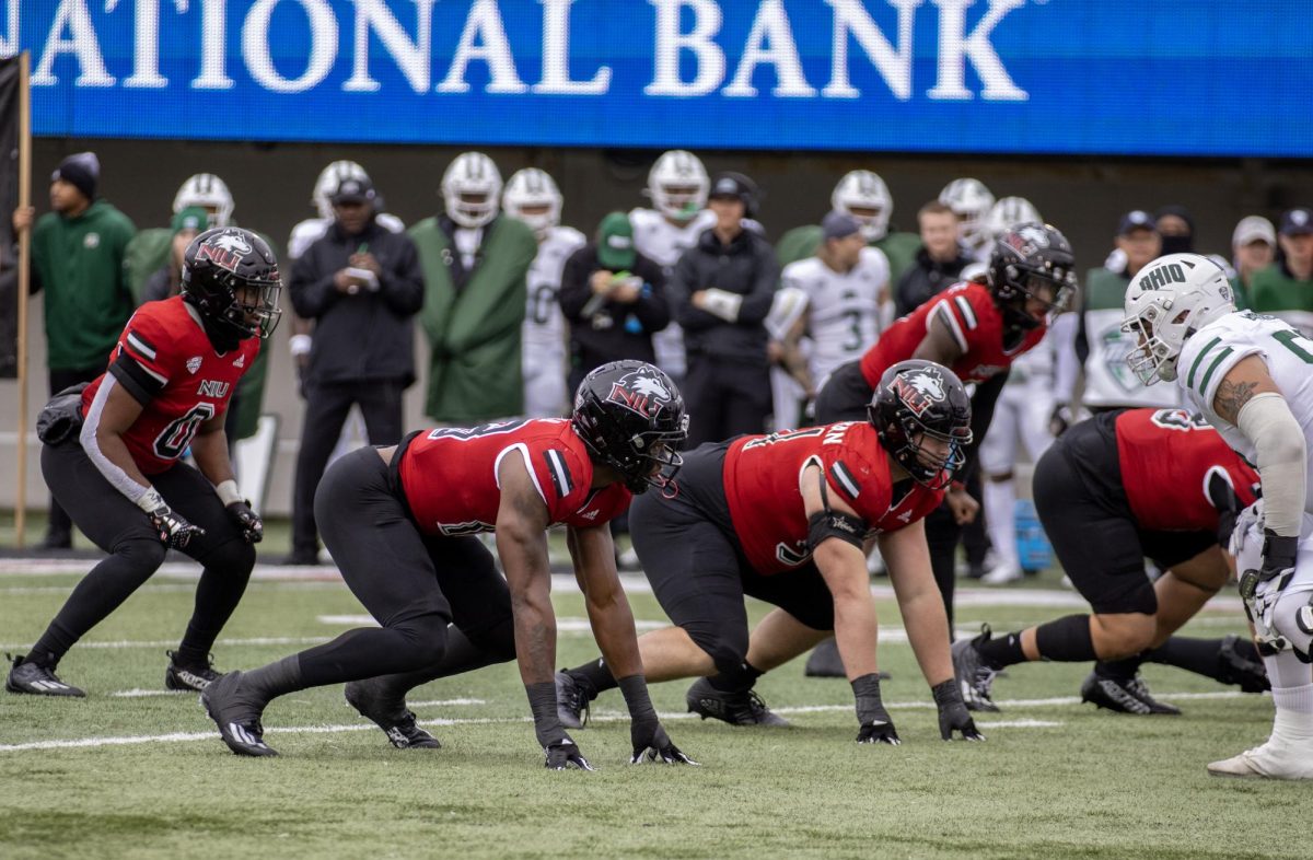 Then-senior linebacker Tyler Jackson (0) lines up behind then-redshirt sophomore George Gumbs Jr. and then-junior defensive tackle Cade Haberman in an NIU football home game against Ohio University on Oct. 14, 2023. NIU footballs 2024 schedule was released Tuesday. (Tim Dodge | Northern Star)