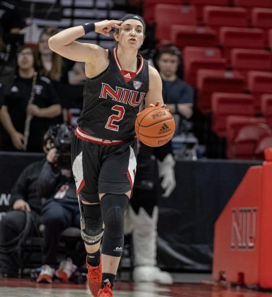 Redshirt junior guard Sidney McCrea (2) signals to her teammates as she dribbles the ball up the court against Bowling Green State University Feb. 24. McCrea earned her first career double-double in a 69-54 loss to University of Akron Saturday. (Northern Star File Photo)