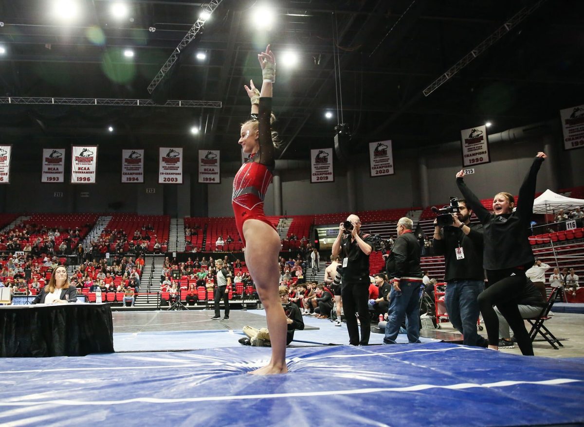 NIU sophomore gymnast Kiera O’Shea salutes at the end of her vault routine during the Huskies’ home-opening tri-meet against Central Michigan University and Eastern Michigan University on Jan. 28 at the Convocation Center. O’Shea was one of two NIU gymnasts to qualify for NCAA Regionals on Monday. (Courtesy of NIU Athletics)