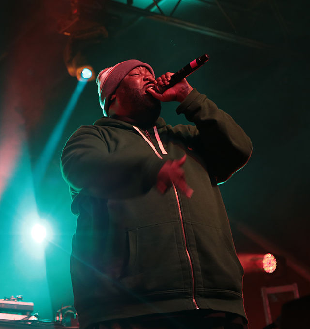 Rapper Killer Mike sings into a microphone on a stage. Killer Mike’s wins at the 2024 Grammys were deserved and serve as an example of why artist popularity should not be prioritized over music quality. (Courtesy of Wikimedia Commons)